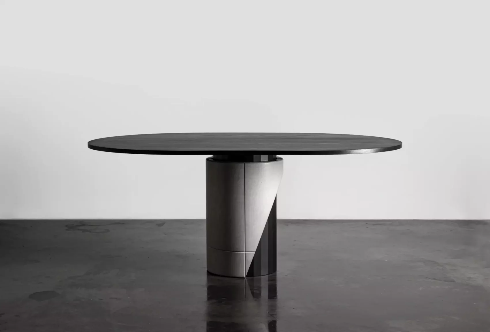 Majestic Dining table for 6 to 8 people black tinted wooden table top and metal and concrete foot for a modern and brutalist style