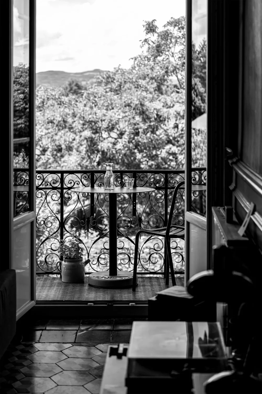black and white photo of the Donut table on a country house balcony