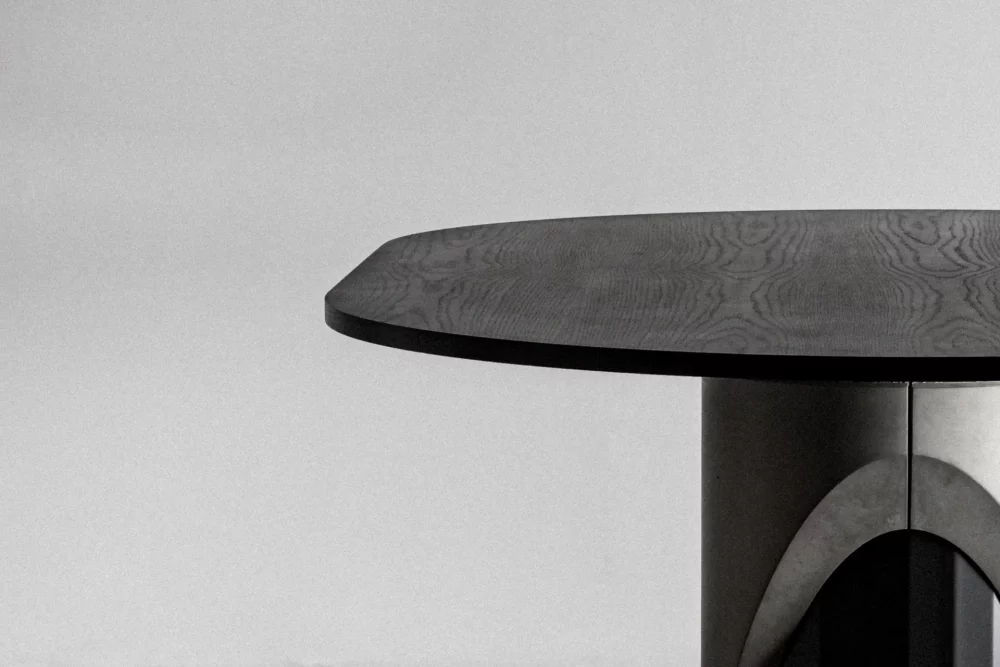Detail of the wooden tinted matt black oak tabletop of the Sharp dining table by Bertrand Jayr